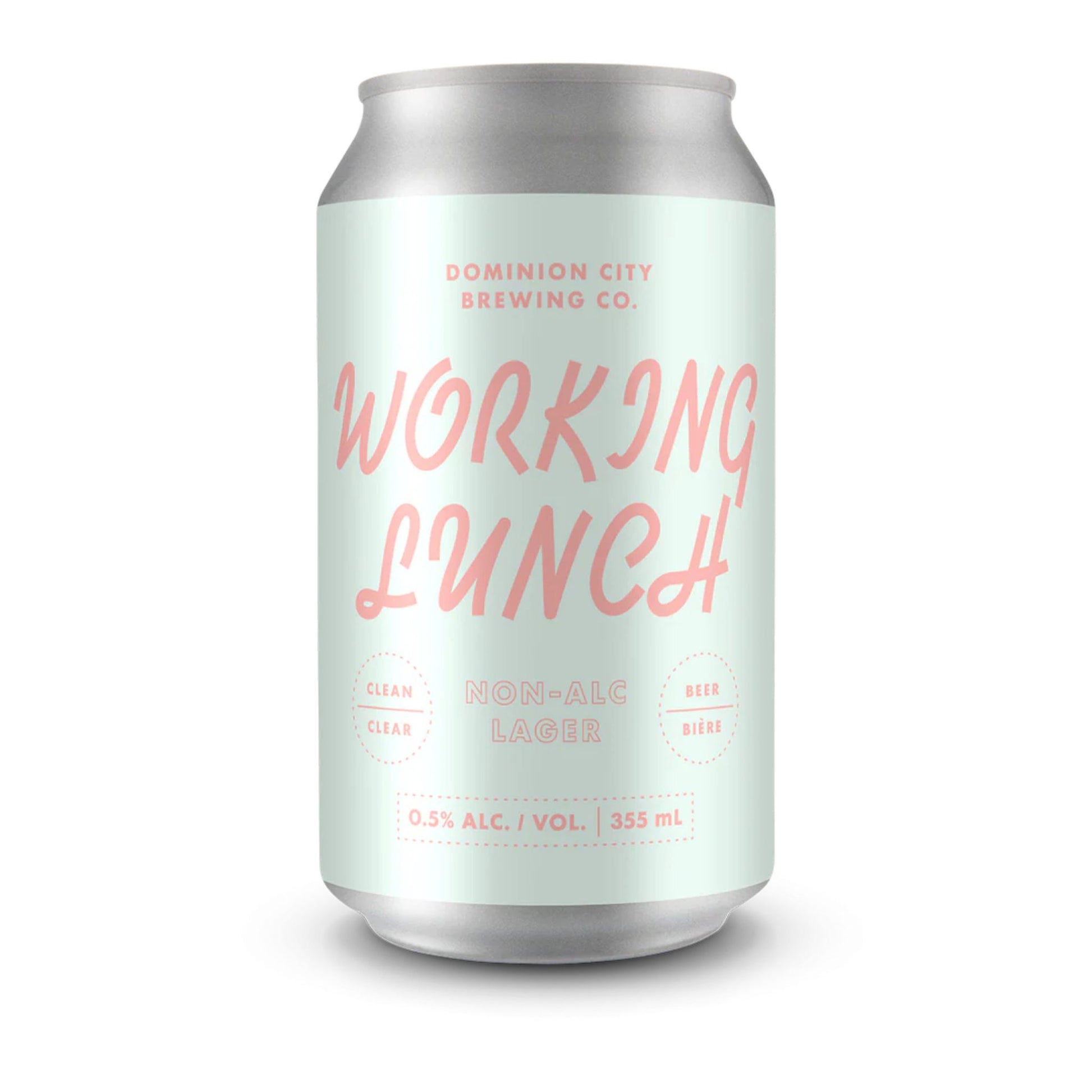 A close-up image of a silver beverage can featuring a light mint green label. The label reads "DOMINION CITY BREWING CO." in pink at the top, and "WORKING LUNCH" in a larger, stylized pink font below. Further down, it says "NON-ALC LAGER" in pink, with "CLEAN" and "CLEAR" on the left and "BEER" and "BIÈRE" on the right, all in smaller pink text within dashed circles. At the bottom of the label, "0.5% ALC. / VOL. | 355 mL" is printed. The background is a clean white, emphasizing the can.
