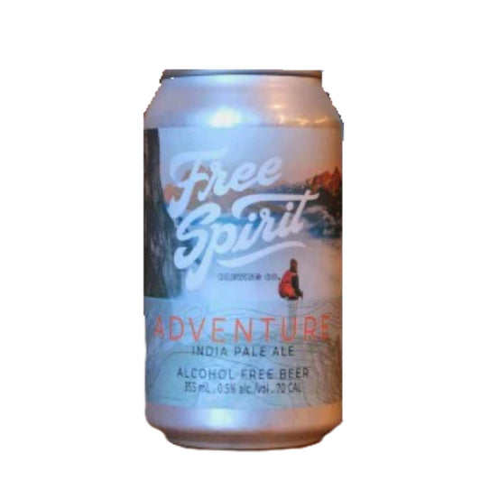 A light-colored beverage can with a serene nature-inspired label. The label features a white background with a mountain landscape in muted tones and a small figure in an orange jacket seated near water. "Free Spirit" is written in a stylized white font at the top. Below this, "ADVENTURE" is prominent in red, followed by "INDIA PALE ALE" and "ALCOHOL FREE BEER". The can also displays "355 mL, 0.5% alc./vol., 70 CAL". The background is white.