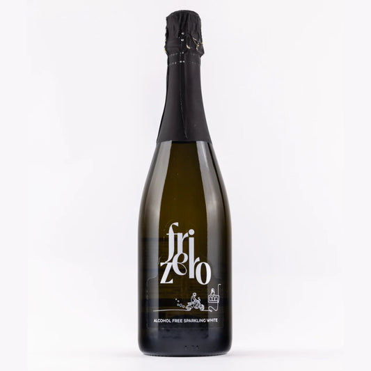 A front-facing view of a Frizero bottle, showing the light-colored sparkling beverage, a black cap, and a white label with the brand name "Frizero" and the text "ALCOHOL FREE SPARKLING WHITE".