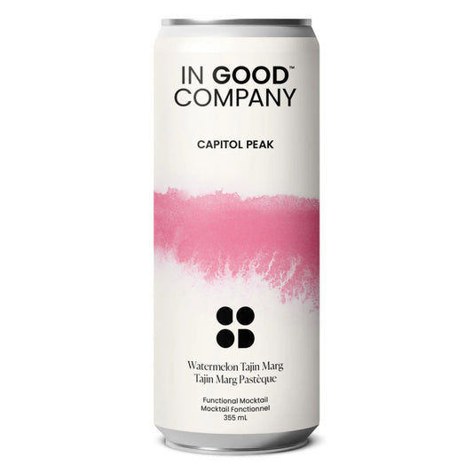 A can of In Good Company Watermelon Tajin Marg. The can has a clean, white label with a bold pink, paint-stroke design in the middle. The label reads "IN GOOD COMPANY" and "CAPITOL PEAK" at the top. Below the pink design, "Watermelon Tajin Marg" and "Tajin Marg Pastèque" are written. "Functional Mocktail," "Mocktail Fonctionnel," and "355 mL" are also visible at the bottom. The can is set against a white background.