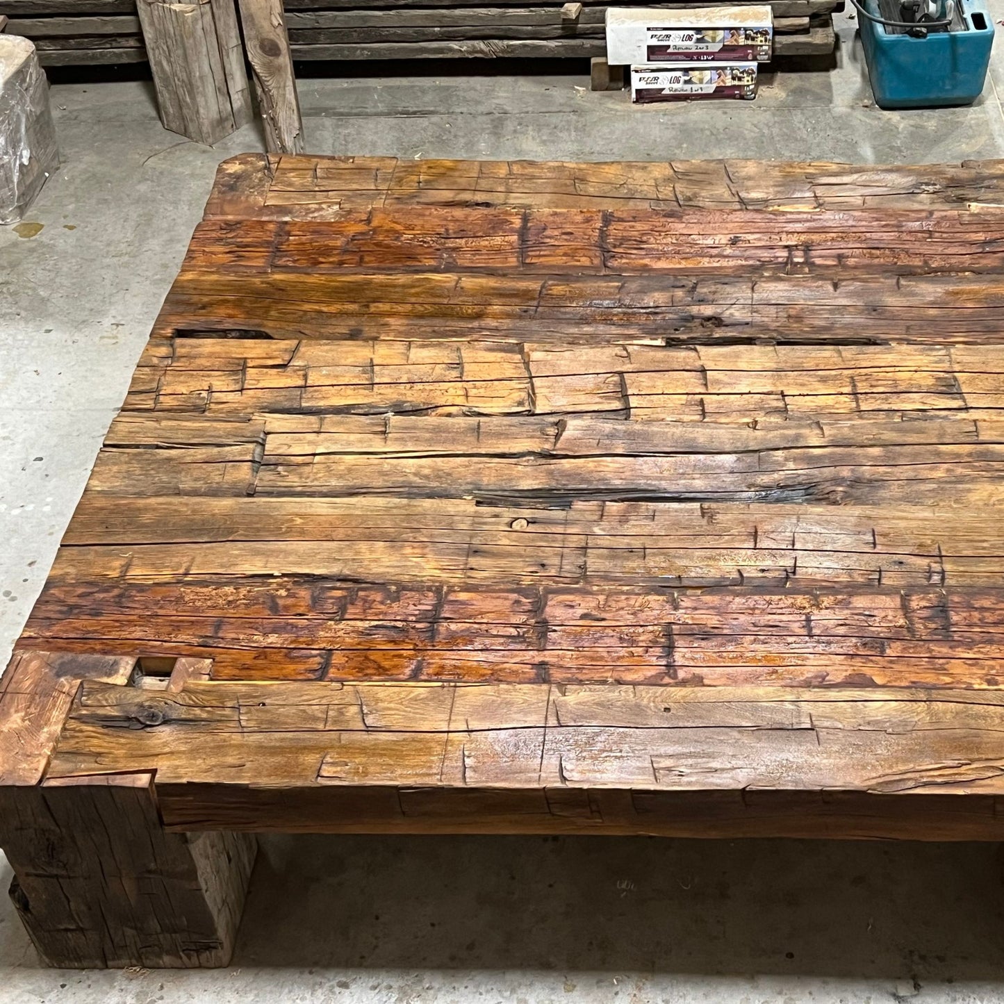 Handcrafted coffee table made from 200-year-old reclaimed Ontario barn wood beams with dovetail joinery by Milano Woodworking