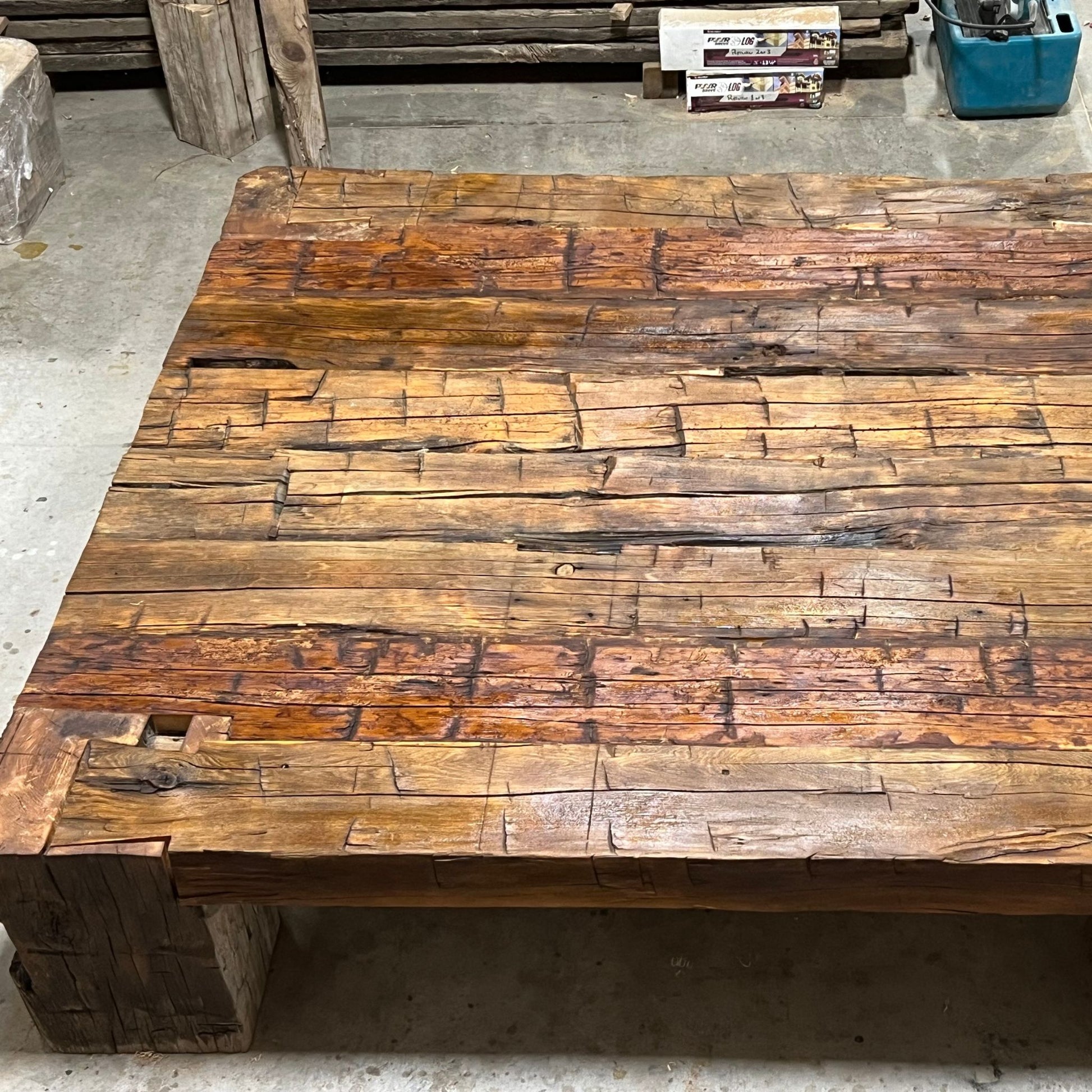 Handcrafted coffee table made from 200-year-old reclaimed Ontario barn wood beams with dovetail joinery by Milano Woodworking