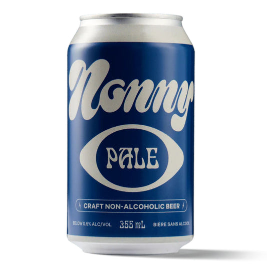 A deep blue can of Nonny Pale non-alcoholic craft beer. The can features a stylized white script font with "Nonny" at the top and "PALE" inside a white oval below. The text "CRAFT NON-ALCOHOLIC BEER" is printed in white at the bottom, along with "BELOW 0.5% ALC/VOL," "355 mL," and "BIÈRE SANS ALCOOL." The background is white.
