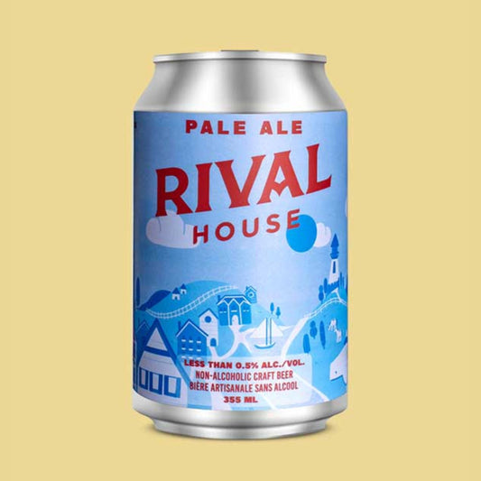 A silver can of Rival House Pale Ale against a pale yellow background. The can's label is light blue and features a whimsical, light-toned village scene with buildings and trees. "RIVAL HOUSE" is printed in large red letters at the top, and "PALE ALE" is written in blue above it. The bottom of the label has text that reads "LESS THAN 0.5% ALC./VOL. NON-ALCOHOLIC CRAFT BEER" and "BIÈRE ARTISANALE SANS ALCOOL" along with "355 mL".