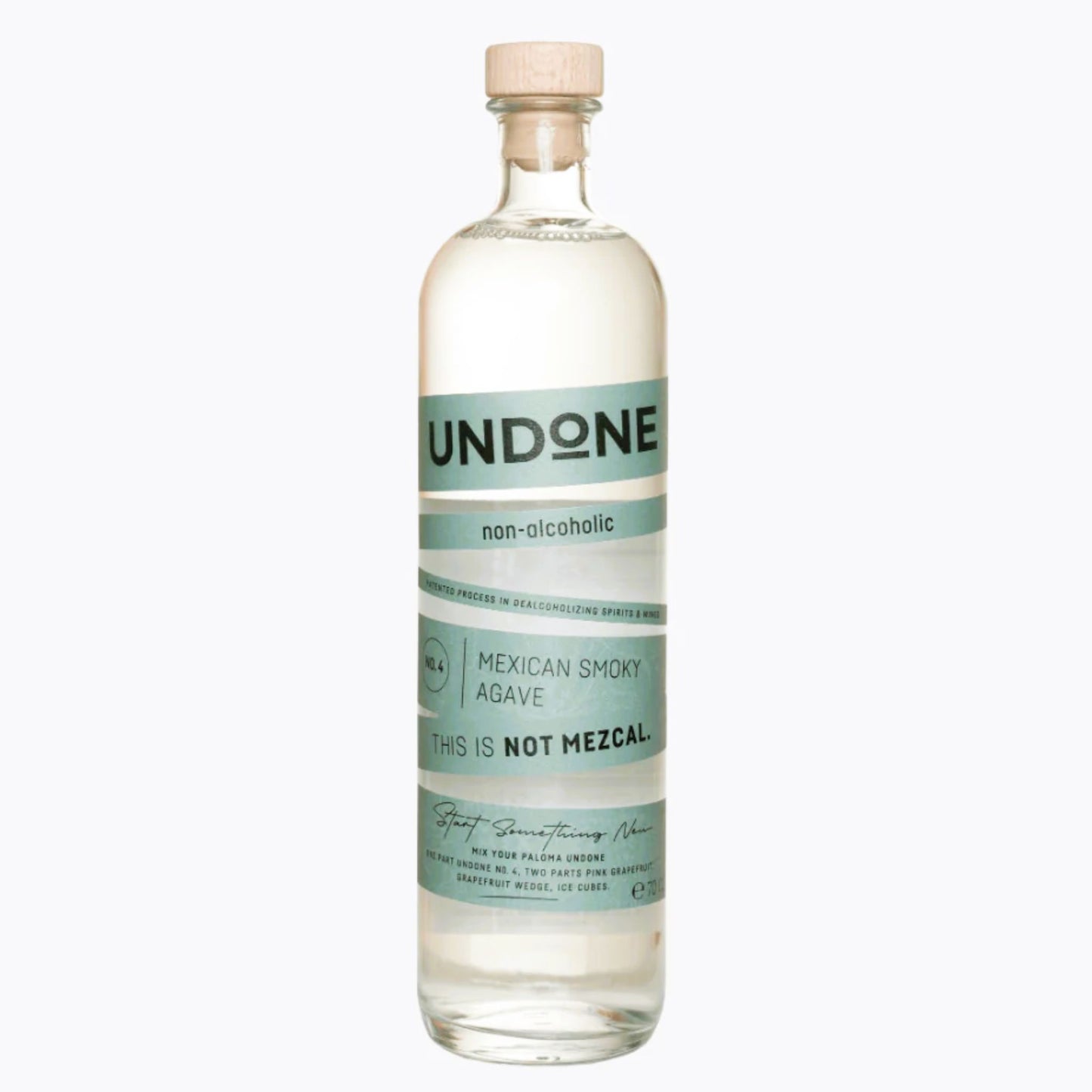 A clear, high-resolution product shot of a corked glass bottle of UNDONE non-alcoholic Mexican Smoky Agave (No. 4, 700ml) against a white background. The transparent spirit is visible inside. The label, featuring a soft teal/mint green and white design, clearly states "UNDONE," "non-alcoholic," and "MEXICAN SMOKY AGAVE" with the tagline "THIS IS NOT MEZCAL." This image is optimized for users searching for non-alcoholic tequila alternatives, alcohol-free agave spirits, or smoky zero-proof mezcal substitutes.