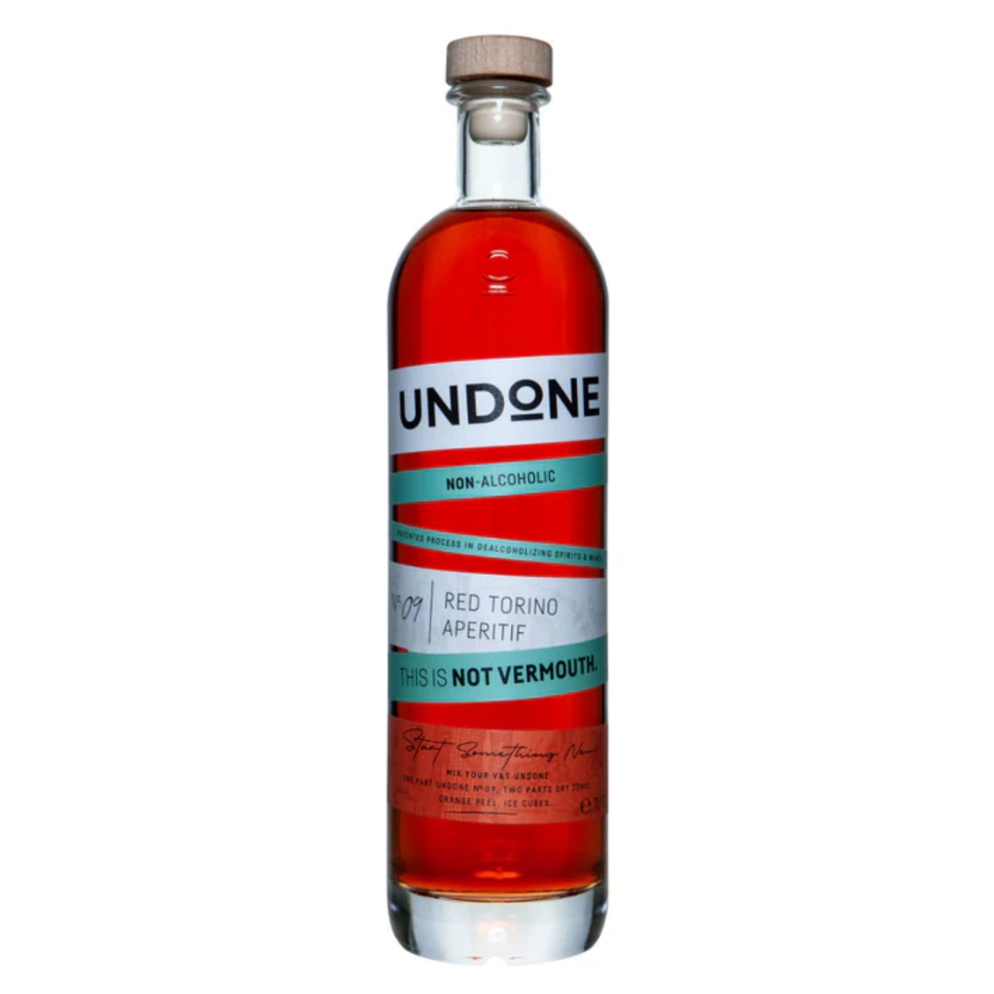 A tall, clear glass bottle of UNDONE Non-Alcoholic Red Torino Aperitif. The liquid inside is a deep, rich reddish-amber color. The bottle has a natural wood-colored cork stopper. The white label wraps around the bottle with alternating horizontal stripes of white and a teal/mint green color. Key text on the label, from top to bottom, includes: UNDONE, NON-ALCOHOLIC, a smaller section indicating RED TORINO APERITIF next to the number 09, and a prominent teal stripe that states: THIS IS NOT VERMOUTH. Near the