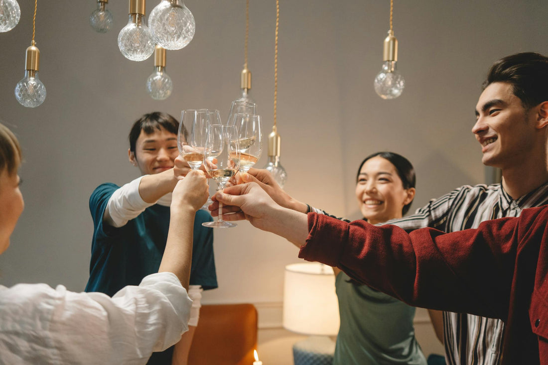 A group of friends clinking glasses and sharing a toast.