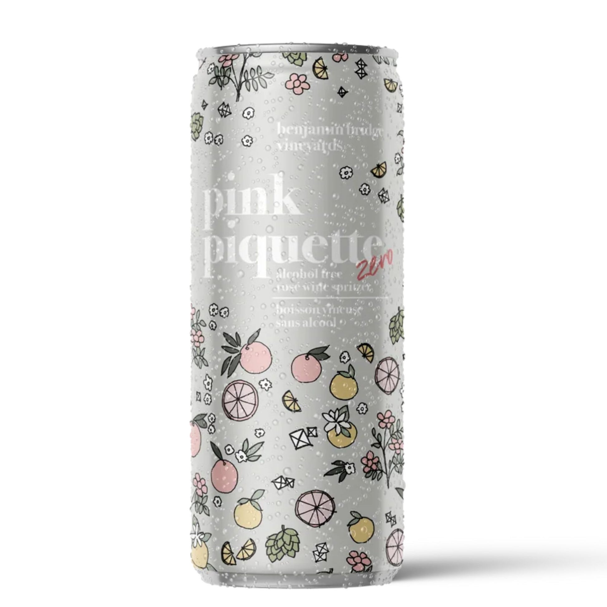 A 250ml slim can of Benjamin Bridge Vineyards Pink Piquette Zero, an alcohol-free wine-style beverage. The slim can has condensation droplets and features a detailed, hand-drawn floral and citrus fruit pattern on a silver background. The text specifies it is "pink piquette zero," "alcohol free wine-style beverage," and "0% alc/vol with natural flavour, berry & sea salt." Available at Knyota non alcoholic drink Ottawa. Proudly made in Nova Scotia. 

Available at Knyota Drink in Ottawa. Buy local! 