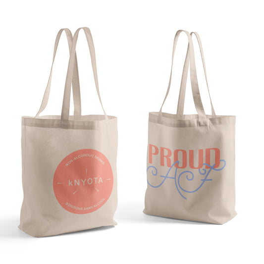 A durable zippered tote bag with sturdy handles and a spacious interior, perfect for carrying groceries, books, or everyday essentials. The bag features a sleek custom Proud AF hand lettering design by a local Ottawa artist and a KNYOTA logo.