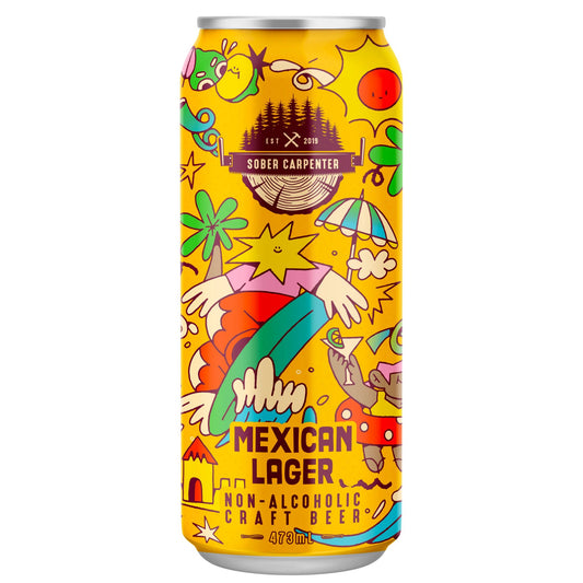 A vibrant yellow can of Sober Carpenter Mexican Lager with a colorful, cartoon-style illustration. The illustration depicts a beach scene with a person holding a surfboard, an umbrella, and various abstract shapes and figures. "SOBER CARPENTER" is written on a banner at the top, along with "EST. 2019". The bottom of the can reads "MEXICAN LAGER," "NON-ALCOHOLIC CRAFT BEER," and "473ml". The background is a solid white.