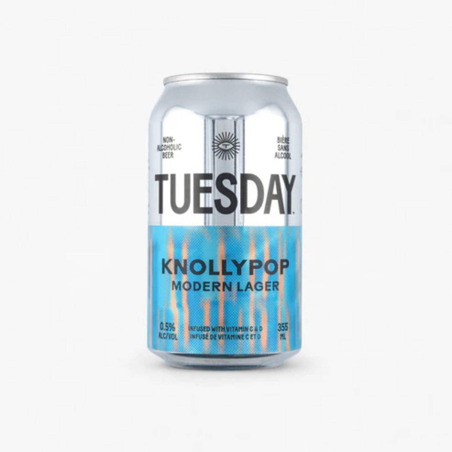 The image shows a silver can of Tuesday Knollypop Modern Non-Alcoholic Lager. The can has a black label with the brand name "Tuesday" in large white letters. The can is labeled as non-alcoholic beer with 0.5% alcohol by volume. It is also infused with vitamins C and D.