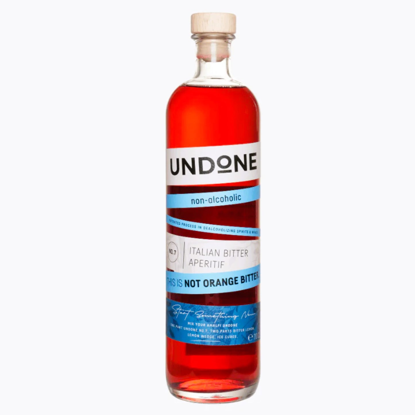A clear product photograph of a corked glass bottle of UNDONE non-alcoholic Italian Bitter Aperitif (No. 7, 700ml). The liquid inside is a vibrant, appealing orange-red color. The label features a white background with bright blue accents, clearly stating "UNDONE," "non-alcoholic," and "ITALIAN BITTER APERITIF" with the critical phrase "THIS IS NOT ORANGE BITTER." This image is optimized for searches for non-alcoholic Italian aperitivos, zero-proof bitter substitutes, or alcohol-free Italian bitter alternat