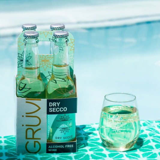 A photo of a four pack of Grüvi Dry Secco. Gruvi is available for purchase from Knyota Drinks at knyota.com