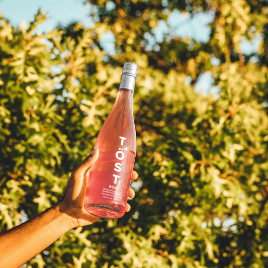 A photo of a full sized bottle of Töst Sparkling Rosé. You can purchase Töst from Knyota Drinks at knyota.com